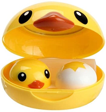 yellow duck face shaped case with smaller duck head and cracked egg shaped contact holders