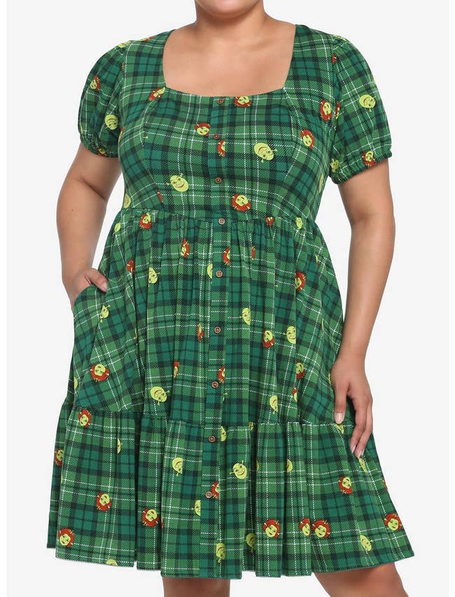 model in green plaid short sleeve square neck knee length dress in shrek and fiona face print