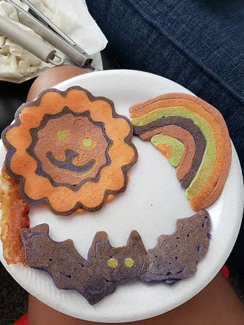 Reviewer image of pancakes in shapes of sun, bat, and rainbow 
