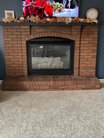 before image of a red brick fireplace