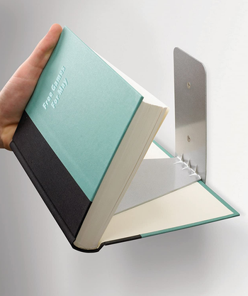 showing the book how it fits onto the book shelf bracket