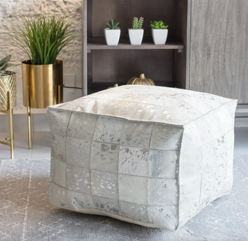 lifestyle photo of white and silver square leather ottoman