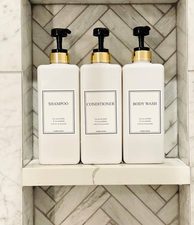 reviewer image of the refillable bottles in a shower