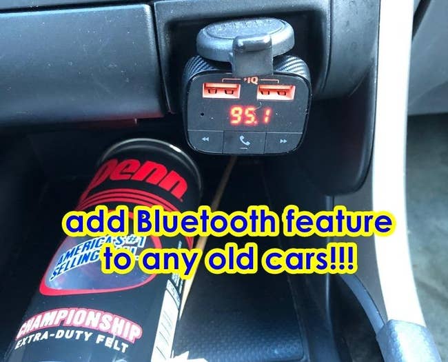 a reviewer photo of the adaptor plugged into a car and text reading 