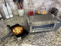 A reviewer's toaster oven which they made pizza in