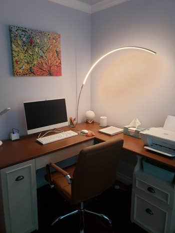 another reviewer's lamp hovering over a  desk 