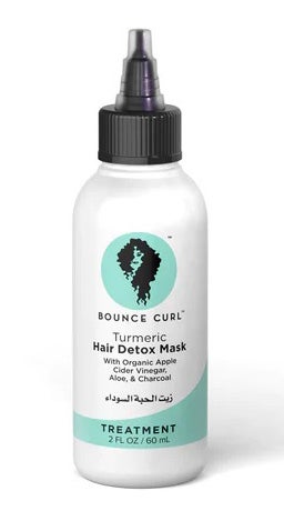 Tumeric hair detox mask in a mini bottle