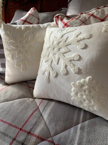 Reviewer's pillows with the white snowflake covers on them
