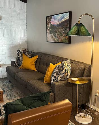 gold lamp with green shade in reviewer's living room