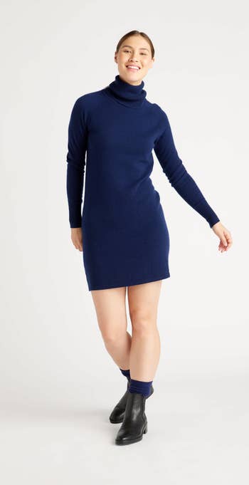 model wearing the dress in navy blue