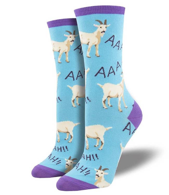 blue socks with purple trim printed with goats and the word 