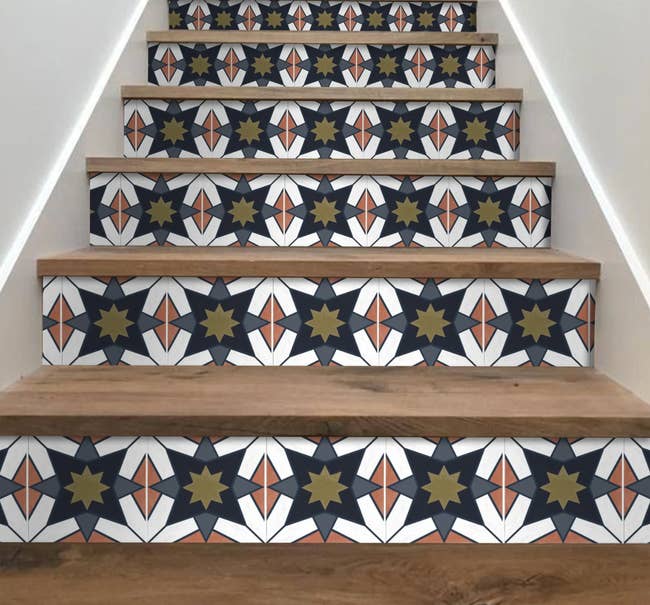 the mosaic peel-and-stick tiles on a set of stairs