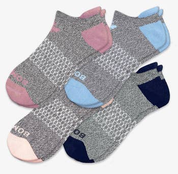 a four pack of ankle socks in four different colors 