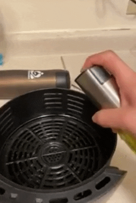 a gif of a reviewer spraying the mister