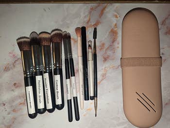 a reviewer's case closed with all the brushes that fit inside on the side