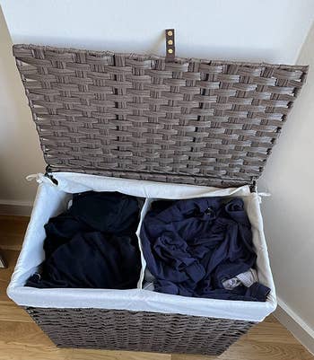 a reviewer photo of the same hamper with the lid open showing the two inner comprtments 