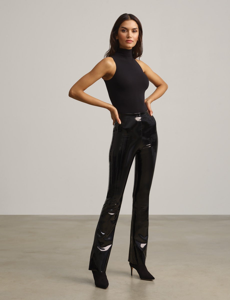 Image of model wearing black patent leather pants
