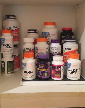 Reviewer showing supplements on organizer shelf