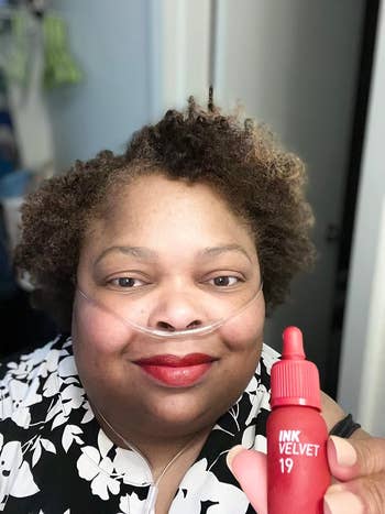 reviewer wearing red number 19 shade of lipstick