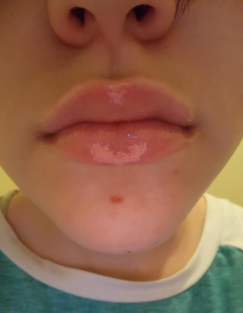 reviewer with glossy lips