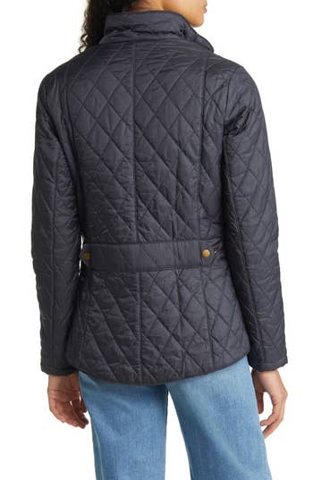 back view of a model wearing a quilted jacket