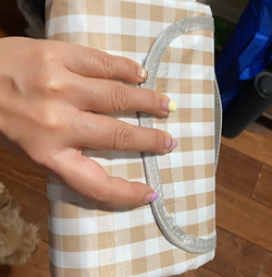 A reviewer shows the folded blanket