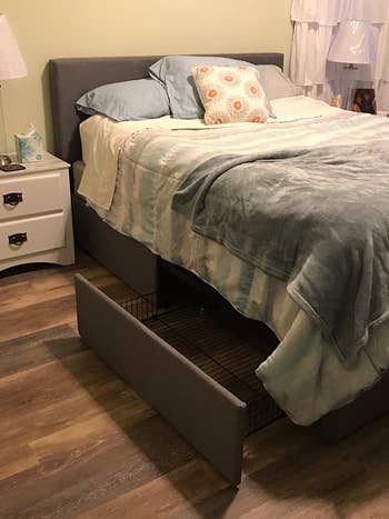 reviewer photo of the platform bed frame in bedroom, drawer open