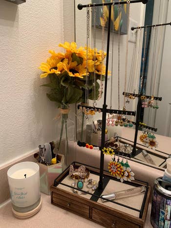 reviewer photo, jewelry tree with drawers on bathroom counter