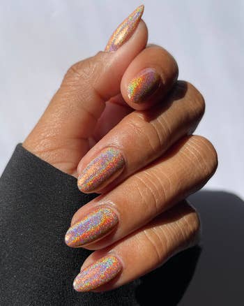 A model with holographic white nails 