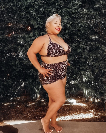 reviewer wearing suit in leopard print 
