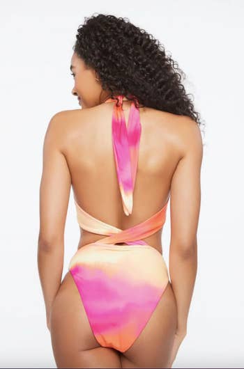 model shown from back with crisscross straps connecting top and bottom