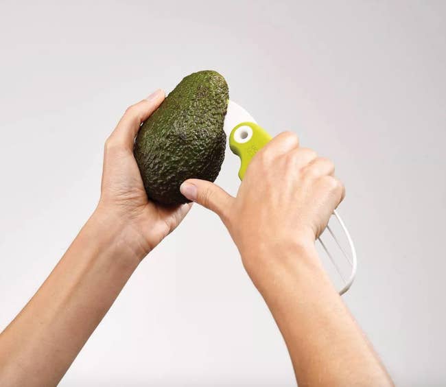 model cutting into avocado 