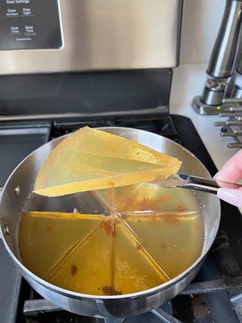 Pan on stove with solidified oil