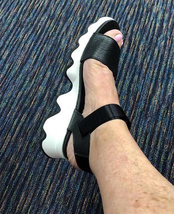 image of reviewer wearing the black sandal