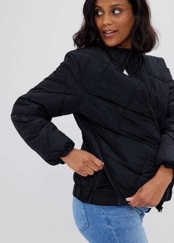 a model in a black quilted coat