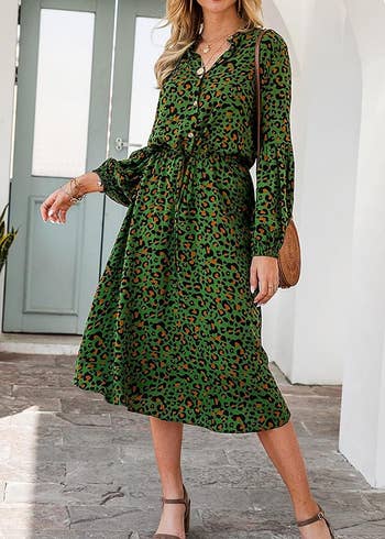 Model wearing the green leopard print dress