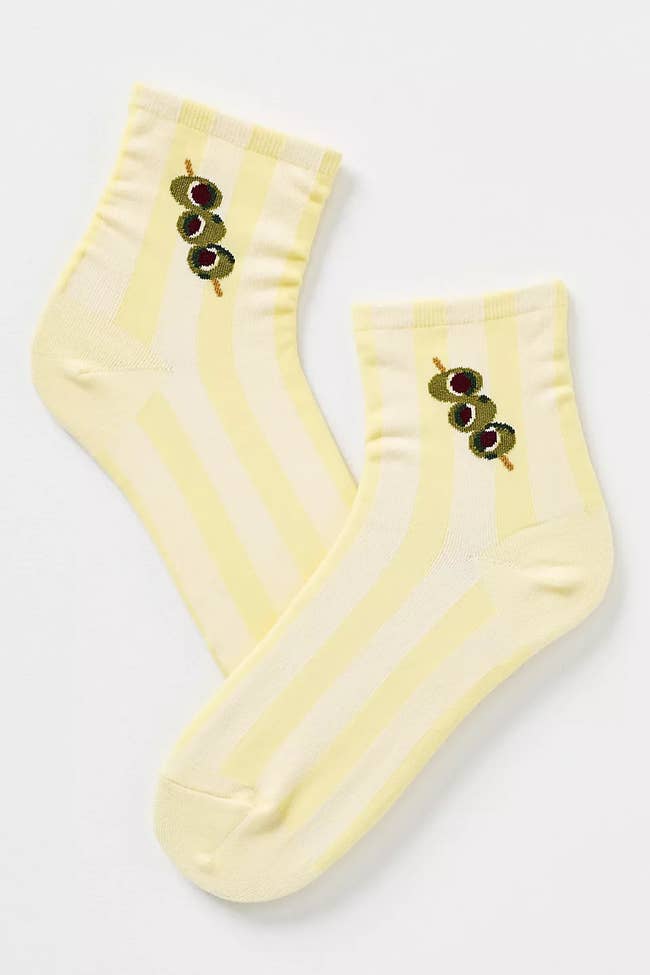 Pair of ankle socks featuring a playful olive design, suitable for casual wear