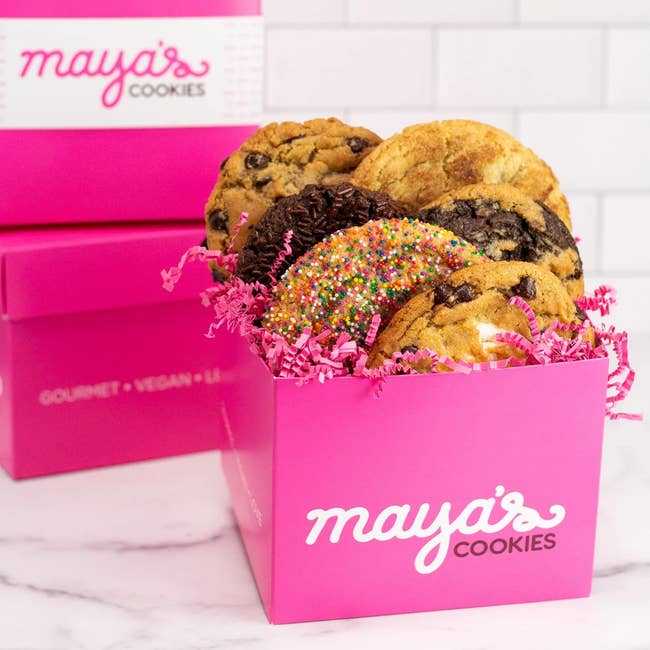 Box of assorted gourmet cookies with sprinkles and cocoa chips, branded with