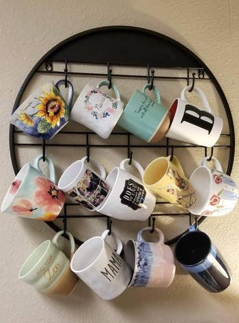 reviewer photo of round mug holder on the wall
