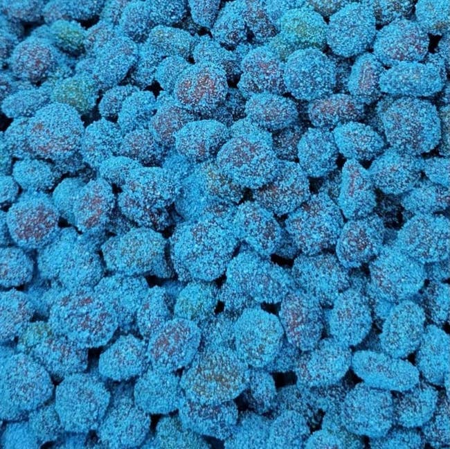 Close-up of respective  bluish  sugar-coated gushers piled together