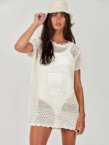 Model in a white crochet dress 