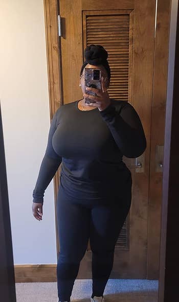 reviewer wearing the black thermal underwear