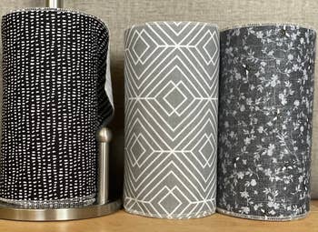 Three rolls of reusable towels in black gray and white patterns
