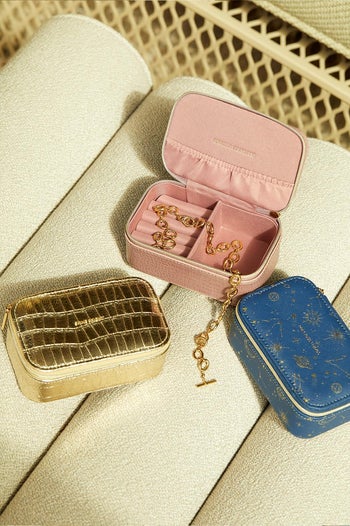 three of the different designs of travel jewelry case