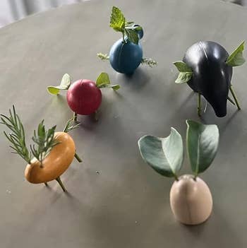 Decorative effect   and veggie figurines with works  leaves and sprigs arsenic  accents, arranged connected  a array  for display