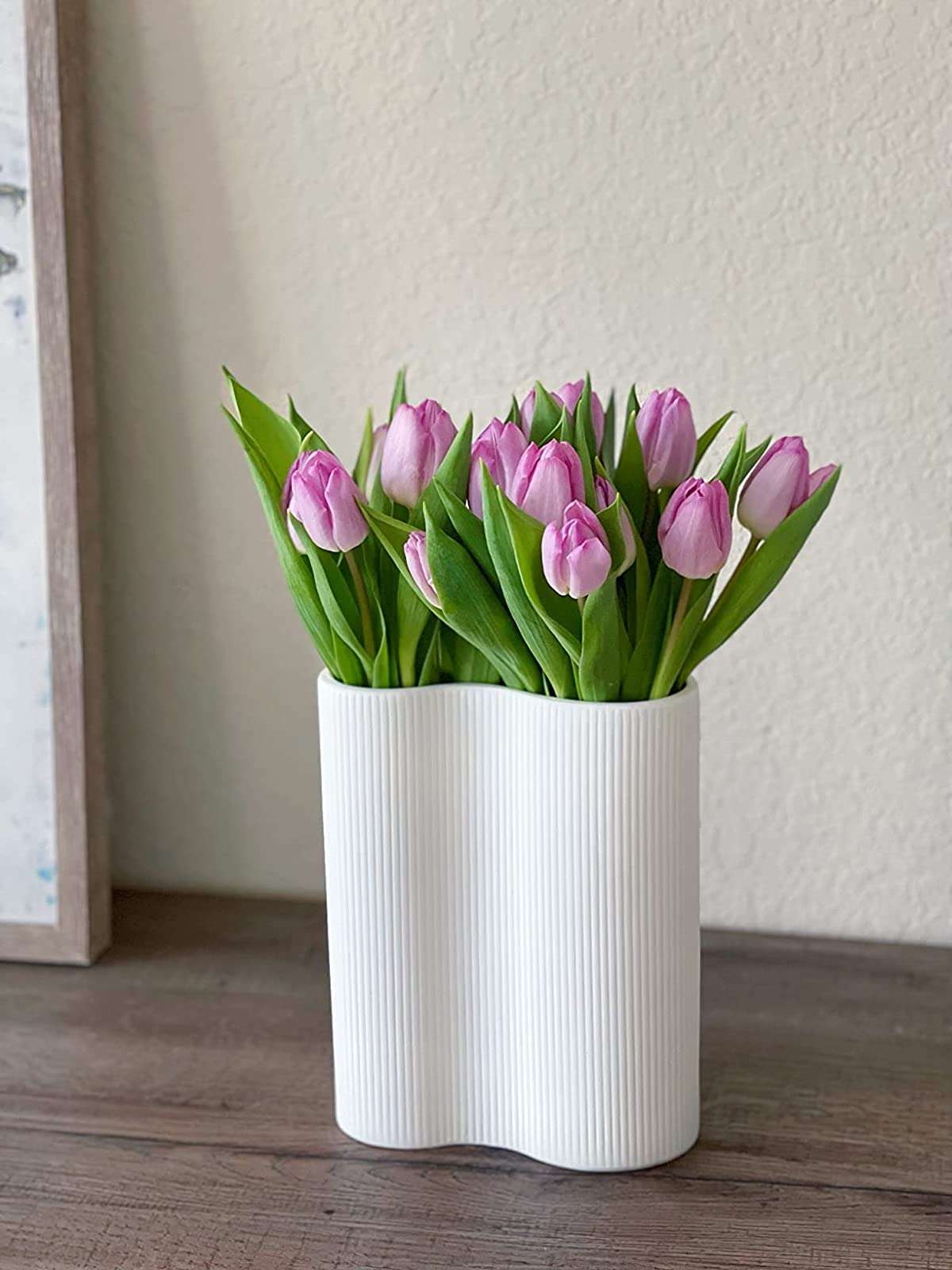 reviewer's white vase filled with purple tulips