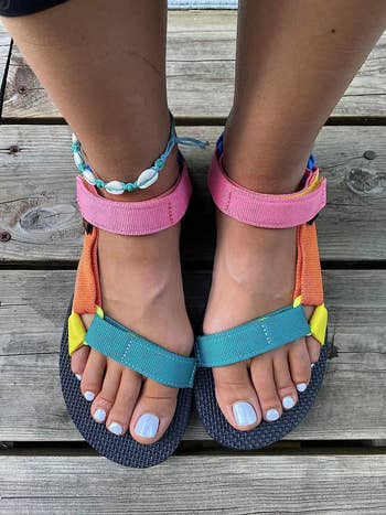 reviewer's feet in the colorful tevas