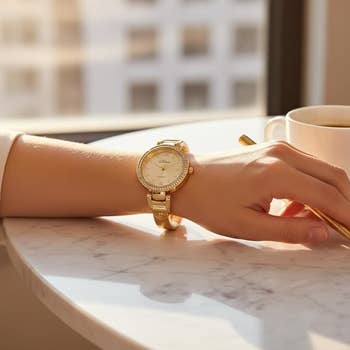model wearing the ticker  successful  golden  with rhinestone details