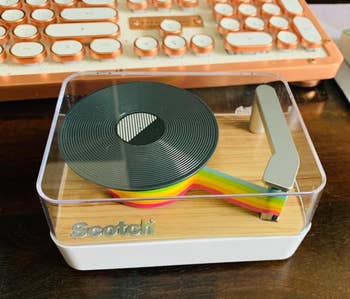 a reviewer's dispenser with rainbow tape