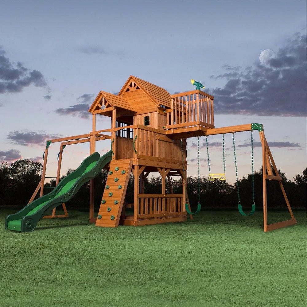 a large wooden swing and play set with green plastic accessories and detailing 